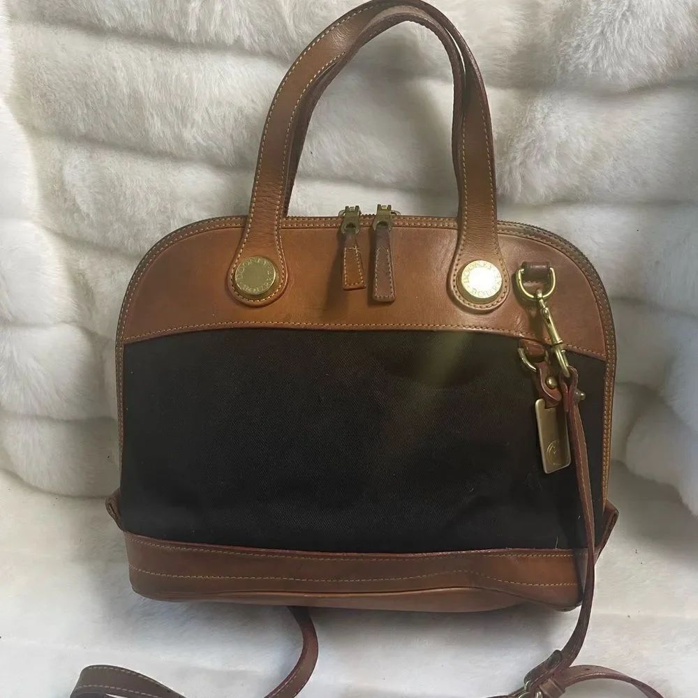 Dooney & Bourke Vintage black canvas and tan leather Dome shoulder bag .